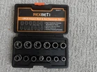 Rexbeti 13PCS Impact Bolt And Nut Remover Set Damaged Stripped Hex Lug Stud Tool Used. Price: $25.00.
